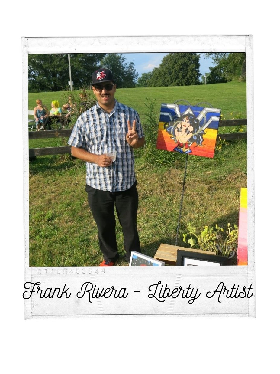 Man supported by Liberty ARC in garden smiling with a baseball cap and sunglasses near his painting of Wonder Woman.