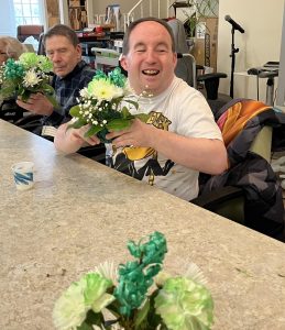 People making floral arrangements